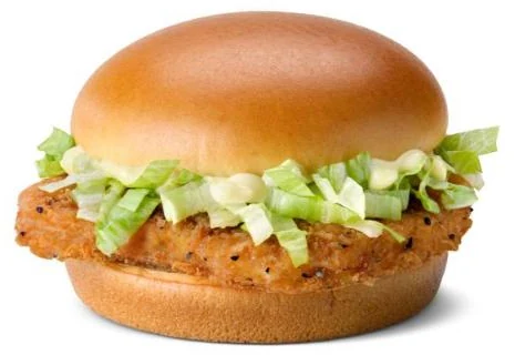 McDonald's McChicken sandwich with a breaded chicken patty, shredded lettuce and mayonnaise on a toasted bun